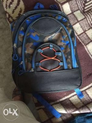 Black, Blue, And Brown Camouflage Backpack