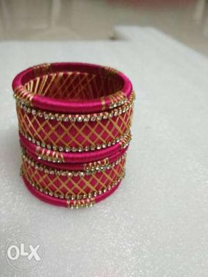 Gold-colored And Pink Silk Thread Bangles