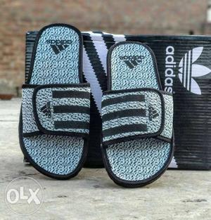 Pair Of Gray-and-black Nike Slide Sandals