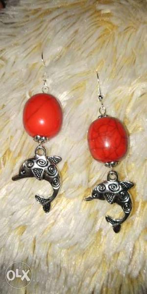 Red And Silver-colored Dolphin Dangling Earrings