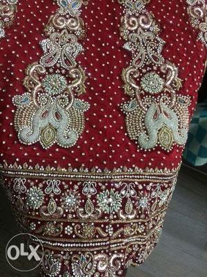 Red color bridal lehnga with heavy silver zircon