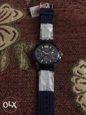 Round Black And Blue Chronograph Watch With Black Strap