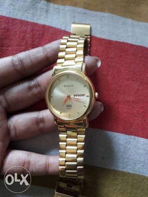 Sonata gold plated time and date indicated wrist