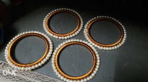 Two Pairs Of Beaded White Bangles