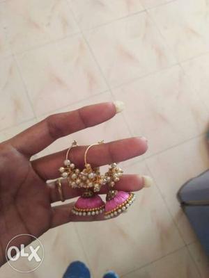 Two Pink And Gold Jhumka Earrings