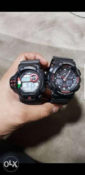 Two Round Black G-SHOCK Digital Watches