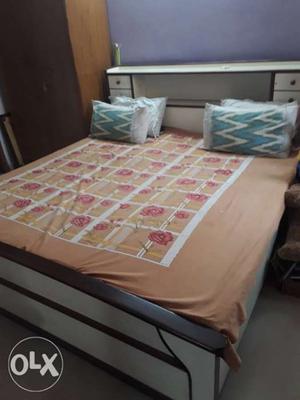A nice and durable double bed with 4 boxes and a