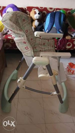 Baby's Green, White, And Red Highchair
