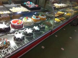 Baked Cakes And Red-framed Display Counter