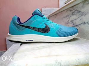 Blue And White Nike Running Shoe