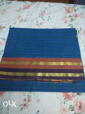 Blue, Red, And Gold Textile