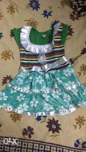 Green dress for baby with heart shaped belt