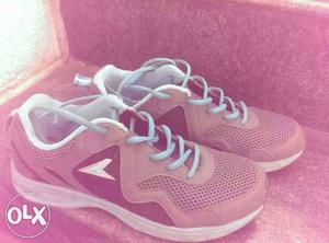 Pair Of Pink New Balance Running Shoes