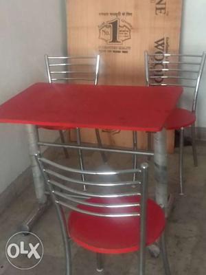 Red And Gray Metal Base Table