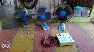 Three Blue And White Desk Fans