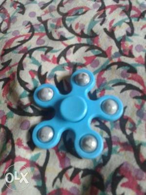 A blue coloured, good fidget spinner