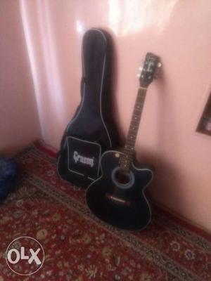 Black Single Cutaway Acoustic Guitar With Black Bag