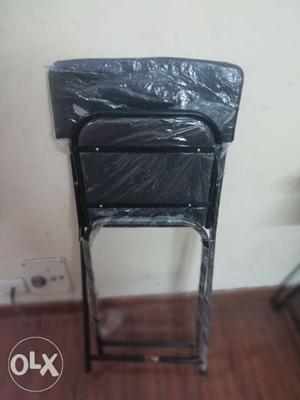 Folding chair with leather seat only 2 months old