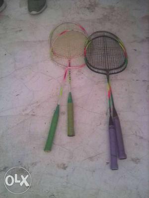Four Black And Green Badminton Rackets