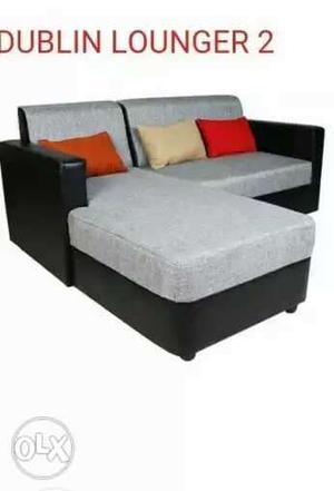 Gray And Black Sectional Couch With Text Overlay
