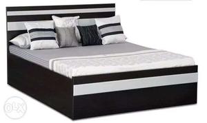 Gray Mattress And Black Wooden Bed Frame