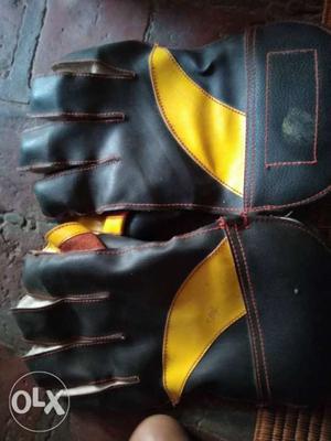 Pair Of Black-and-yellow Leather Gloves
