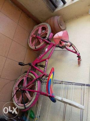Pink And White Bicycle With Training Wheels