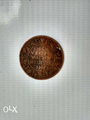 Round Gold-colored 1 Indian Anna Coin