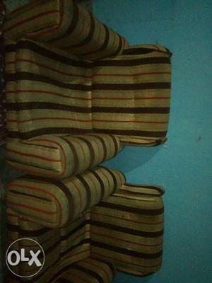 Two Brown-and-black Stripe Sofa Chairs