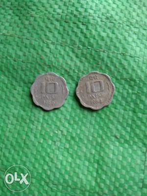 Two Scalloped Silver-colored 10 Indian Paise Coins