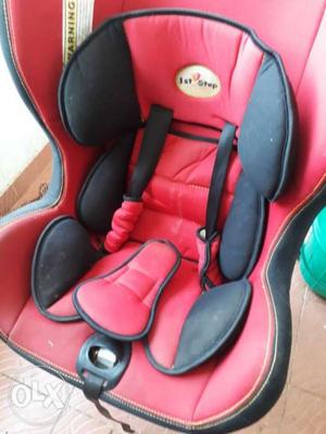 Baby's Red And Black Chicco Car Seat