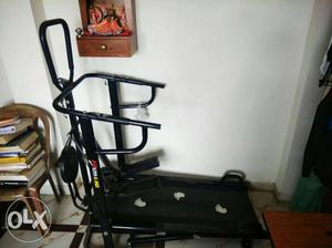 Black And Gray Treadmill And Black And Gray Stationary Bike