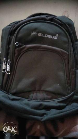 Branded globas bag army color. it is branded with