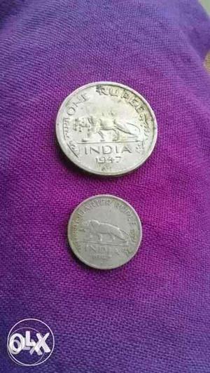 Two Round Silver-colored Indian Coins