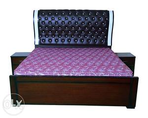 Black double bed with black cushion frame