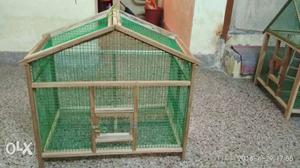 Green And Brown Wooden Framed Pet Cage
