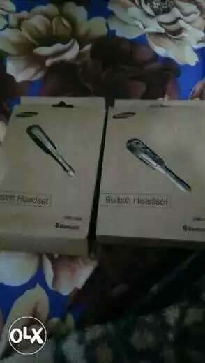 Two Silver Bluetooth Headset Boxes this is new one not old