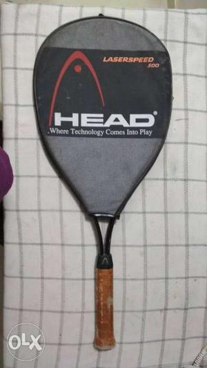 Brown Handle Head Tennis Racket With Black And Gray Case