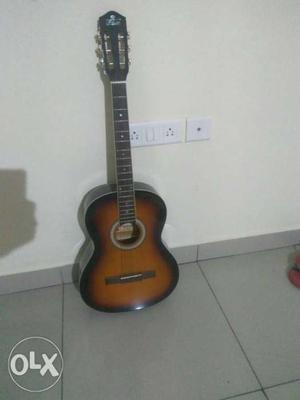 Pluto make sparingly used, brand new guitar with