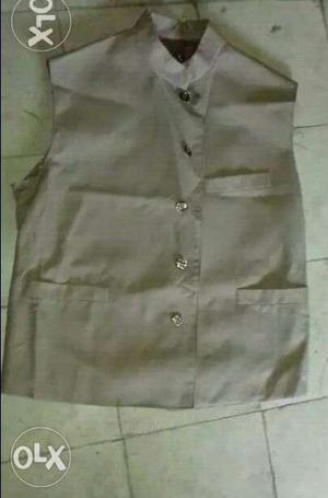 A brown colour cotton blend nehru jacket for sale