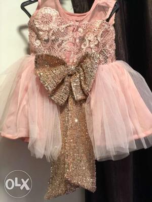 Beautiful pink and golden customized baby dress