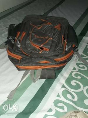Black And Orange Priority Backpack