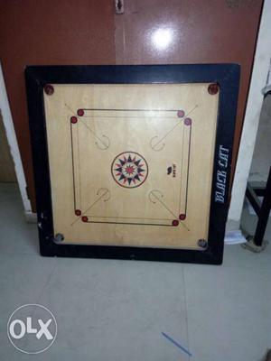 Brown And Black Wooden Carrom Board Game
