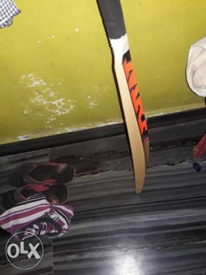 Brown, Red, And Black Wooden Cricket Bat