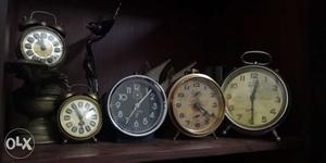 Five Brown And Black Table Clocks