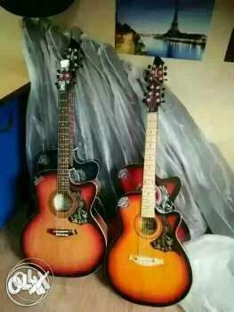 Four Red And Brown Single-cutaway Acoustic Guitars