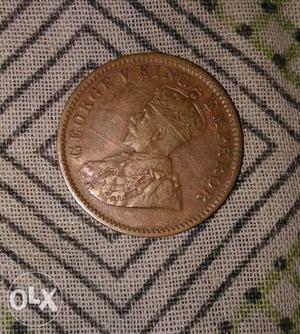Round Copper-colored Emperor George Coin