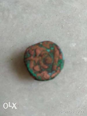Round Green And Brown coin