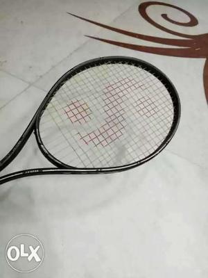 Tennis full size racket. Tight guts. looks like