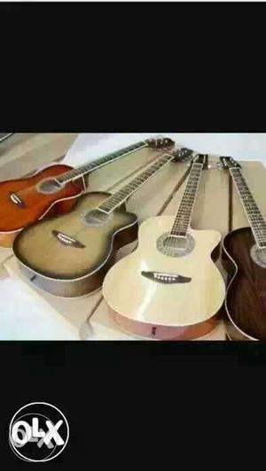 White And Brown Cutaway Acoustic Guitars
